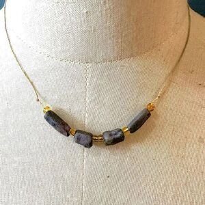 Purple beaded necklace  on cord